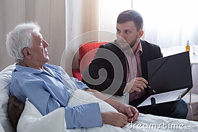 Terminal patient talking with notary Stock Photo