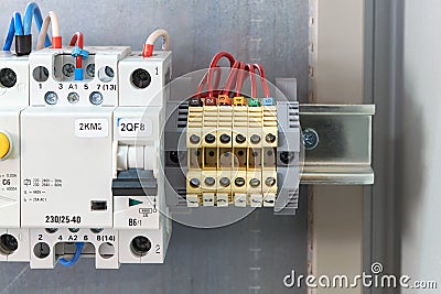 Through terminals, circuit breaker, modular contactor and RCD in electrical Cabinet. Stock Photo