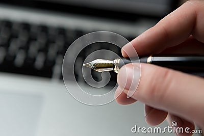Termination letter lying on a laptop computer keyboard with a pen waiting for acknowledgement or signature Stock Photo