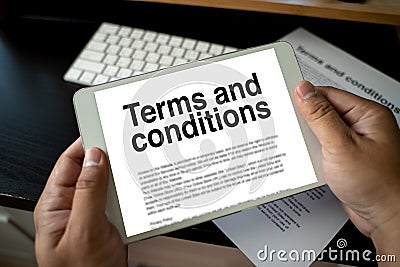 Terms and conditions businessman reviewing terms and conditions of agreement office terms and conditions Stock Photo