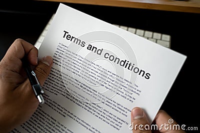 Terms and conditions businessman reviewing terms and conditions of agreement office terms and conditions Stock Photo