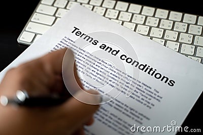 Terms and conditions businessman reviewing terms and conditions of agreement office terms and conditions Stock Photo