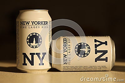 TERNOPIL, UKRAINE - JULY 18, 2022 Two cans of New Yorker fine lager beer with original logo and design on brown retro background Editorial Stock Photo