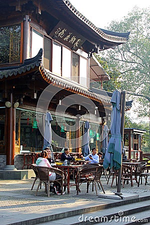 People enjoy their beverages at a cosy terrace along the West Lake (Unesco) in Hangzhou, China Editorial Stock Photo