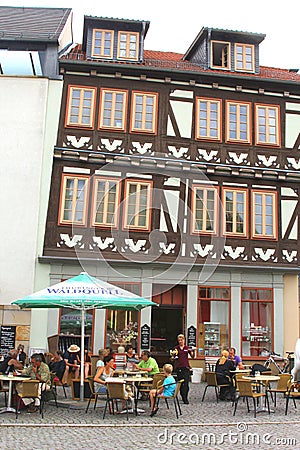 Families at a terrace in fackwerk style in Eisenach, Thuringia, Germany Editorial Stock Photo