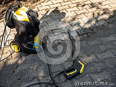 terrace cleaning with pressure washer in the garden Stock Photo