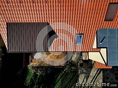 terrace by house.paving tiles brown and yellow. oval table, Stock Photo