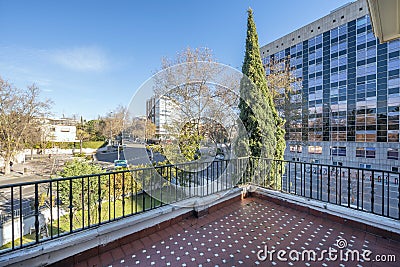 terrace overlooking a garden with trees and a crossroads in the middle Stock Photo