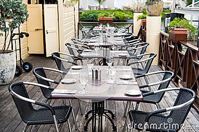 Terrace with tables, chairs and cutlery in philipsburg, sint maarten. Restaurant open air. Eating and dining outdoor. Summer vacat Stock Photo