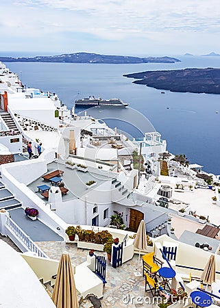 From the terraces of the hotels you have a nice view of the cruise ships that dock at Fira, Santorini, Greece Editorial Stock Photo