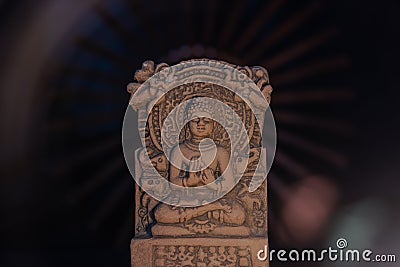 Terracotta Buddha of Sarnath, Varanasi, India in meditative peaceful ray of light Stock Photo