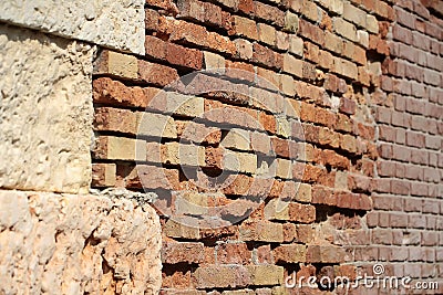 Terracotta rough textured stone facade Stock Photo