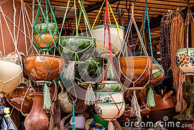 Terracotta pots and pans hanging in a shop in Cuenca, Ecuador Stock Photo