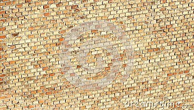 Terracotta wall with medium sized slightly older yellow beige red orange bricks forming a regular pattern. Stock Photo