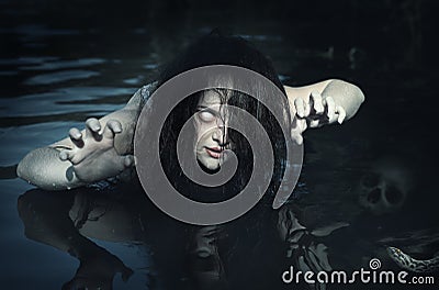 Terrible dead ghost woman in the water Stock Photo