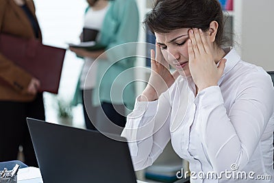 Terrible headache at work Stock Photo