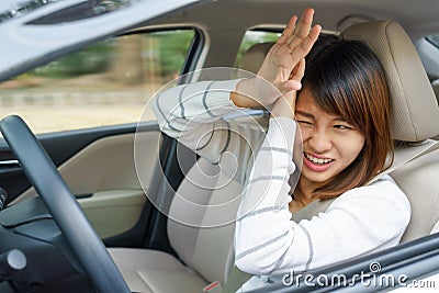 Terrified woman driving and having car accident or crash something. Stock Photo