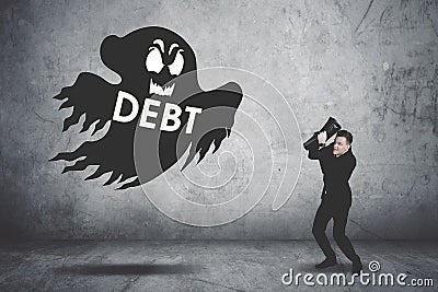 Terrifying businessman covering his face chased by a debt collector Stock Photo