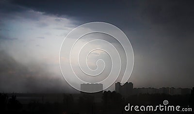 Terrifying dark thunderstorm over a city in Ukraine. Stock Photo