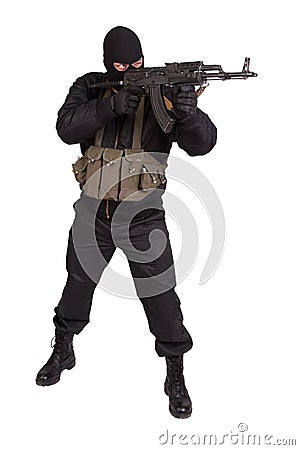 Terrorist in black uniform and mask with kalashnikov isolated Stock Photo