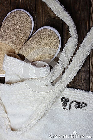 Terry bathrobe and bath slippers Stock Photo