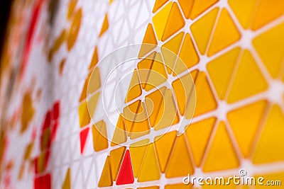 tessellation of a plane with yellow, orange and red colored triangles on a white background. mathematical and artistic game to co Stock Photo