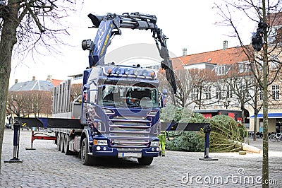 Test For DiabetesCrane lifts and installs a Christmas tree on the town square Editorial Stock Photo