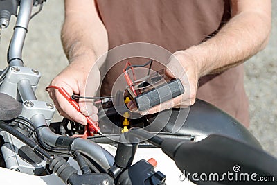 Test of the motorcycle battery Stock Photo