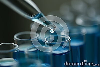 Test tube of glass overflows liquid solution potassium Stock Photo