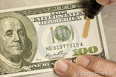 Testing Counterfeit Money Stock Photo