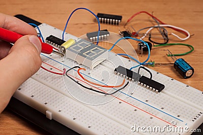 Testing electrical circuit on breadboard Stock Photo