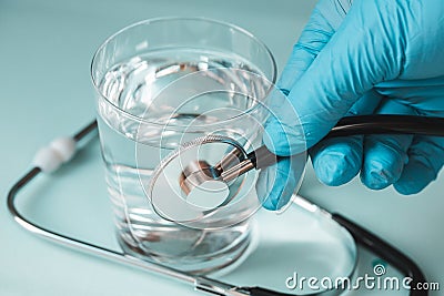 Testing the purity of water in taps and drinking water intakes, Concept Stock Photo
