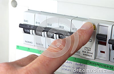 Testing an RCD & x28;Residual Current Device& x29; on a UK domestic electrical consumer unit or fuse box Stock Photo