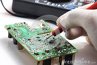 Testing SMD component using multitester Stock Photo