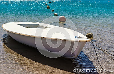 Tethered boat in turquoise water with buoys in Egypt Dahab South Sinai Stock Photo