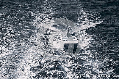 A tethered boat with a water wake Stock Photo