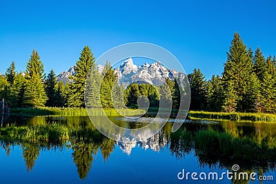 The Teton range at Schwabacher`s Landing in Grand Teton National Park, WY Stock Photo