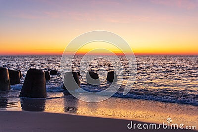 Tetrapods at the beach of Sylt Island at sunset Stock Photo
