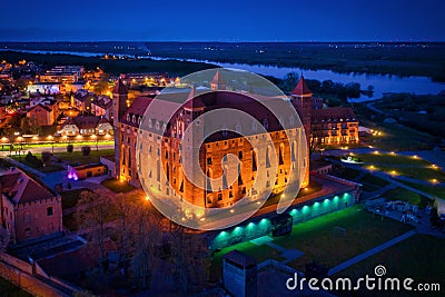 Teutonic castle in Gniew town illuminated at night, Poland Stock Photo