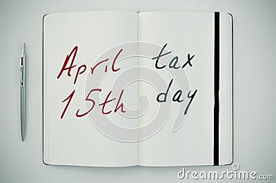 Text april 15th tax day in a notepad Stock Photo