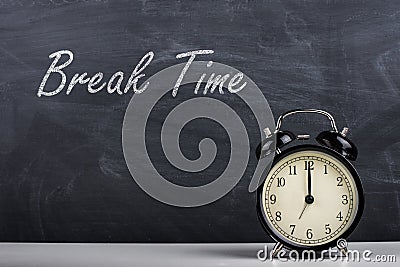 Text Break Time handwritten with white chalk on a blackboard an Stock Photo