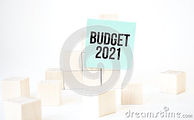Text budget 2021 writing in green card cube ladder. White background. Business concept Stock Photo