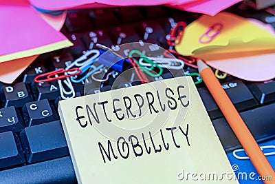 Text caption presenting Enterprise Mobility. Business overview Employees do jobs remotely using a mobile devices Stock Photo