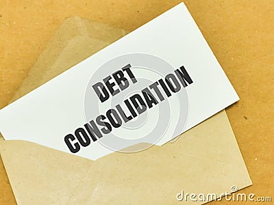Text DEBT CONSOLIDATION written on white paper note in brown envelope. Stock Photo