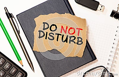 text do not disturb on short note paper on the packing paper box texture background Stock Photo