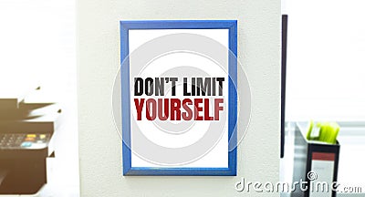 Text DONT LIMIT YOURSELF , isolated white background with printer and folders Stock Photo