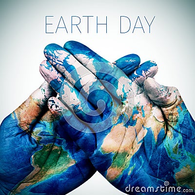 text earth day and man hands patterned with a world map (furnished by NASA) Stock Photo
