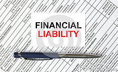 Text Financial Liability written on a business card lying on financial tables with a blue metal pen Stock Photo