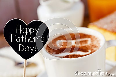 Text happy fathers day and a cup of cappuccino Stock Photo