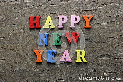 Text Happy New Year of bright multicolored wooden letters Stock Photo